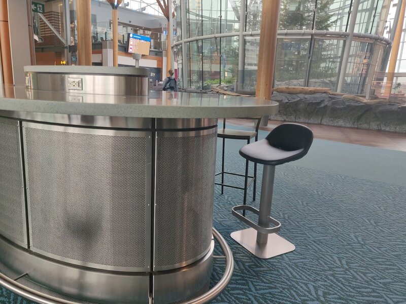 Weird looking oval desk with a fine mesh covering the bottom half. Pretty sure it's covering for ventilation.